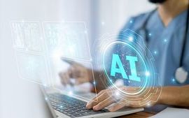 Doctor using a laptop to access AI.