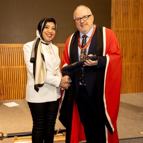 Dr Nesrin Tolba receives her award from Dr Bernie Croal at the New Fellows Ceremony