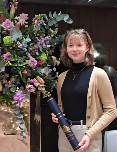 Rosie Walsh collecting the 2024 RCPath Undergraduate Science Communication Prize for her work chairing the University of Manchester Pathology Society