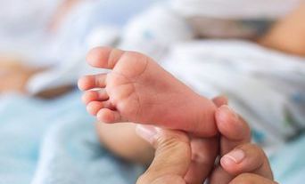 Baby foot being held-sm.jpg