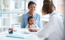 smiling-young-mother-sitting-together-smaller.jpg