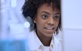 Women researcher looking at computer in lab.jpg