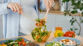 shutterstock_2167530073 (1).jpg Pregnant woman eating 2