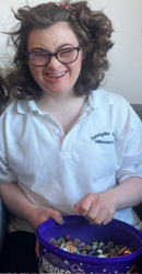 Lucy smiles after an easy experience using the Touch Activated Phlebotomy (TAP) device