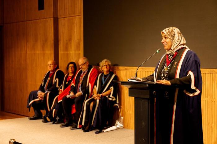 Dr Noha El Sakka, Vice President of Communications, addresses attendees of the New Fellows Ceremony